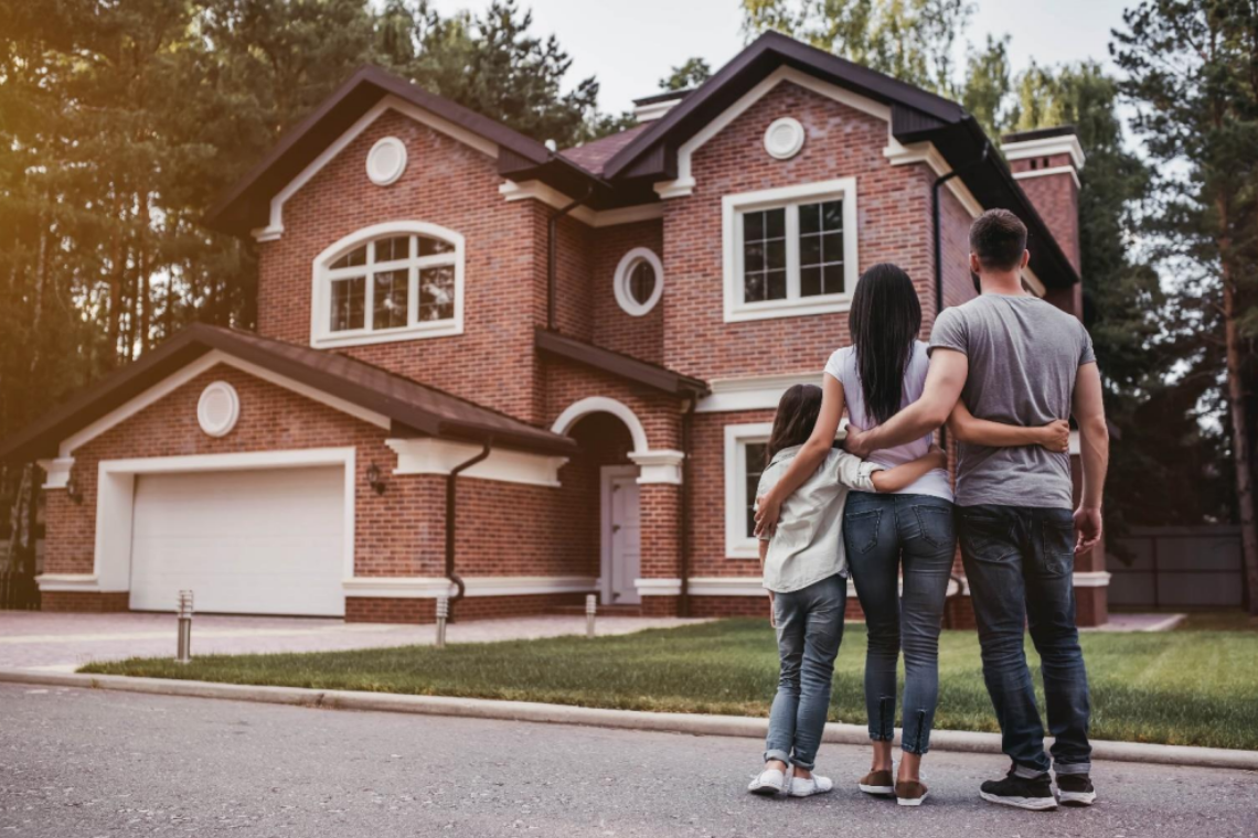 Family outside a house