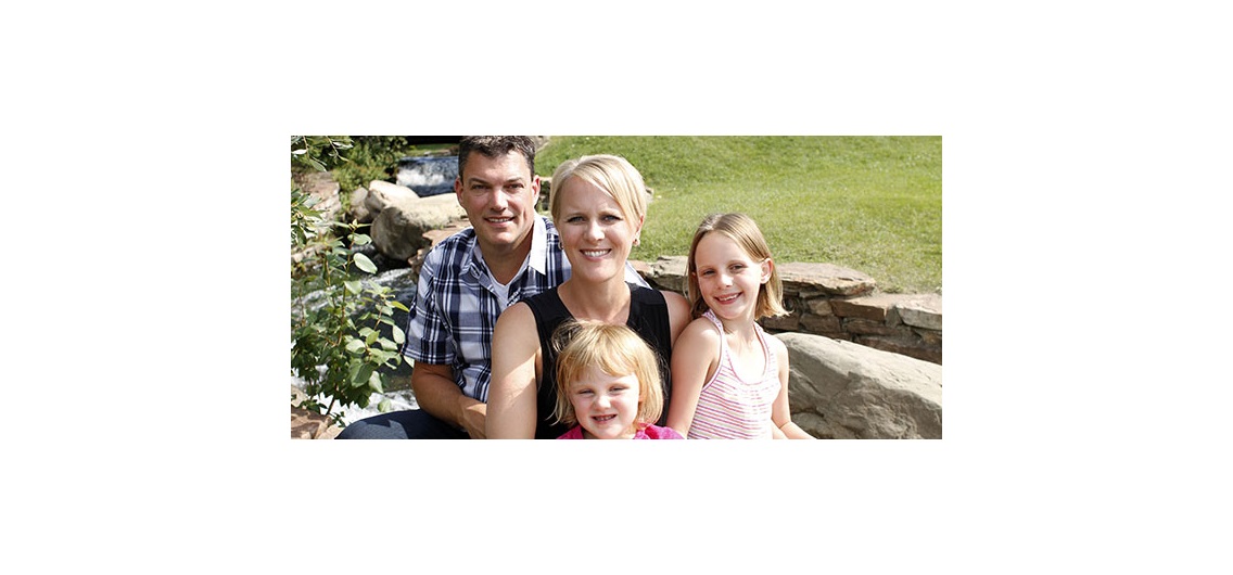 Suzanne Maynard, her husband Gord Clark and daughters Sydney, 3, and Evelynn, 6, enjoying spending warm summer days and nights at their private community lake. Photo by Paula Trotter/Fore CREB®Now.