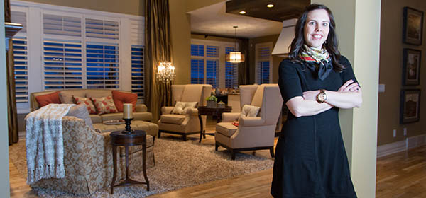 Qualico Communities communications manager Maribeth Janikowski, pictured in the builder's Augusta show home in southwest Calgary, believes the economy has created opportunities in the lower-priced segments. Photo by Adrian Shellard/For CREB®Now
