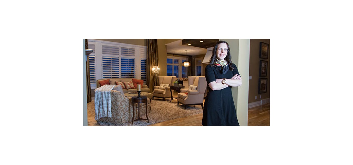 Qualico Communities communications manager Maribeth Janikowski, pictured in the builder's Augusta show home in southwest Calgary, believes the economy has created opportunities in the lower-priced segments. Photo by Adrian Shellard/For CREB®Now