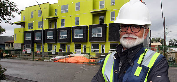 Attainable Homes CEO David Watson stands outside of the not-for-profit organization's Mount Pleasant 1740 project. Watson said local agencies like his are being forced to be more creative in addressing the city's affordable housing needs. Photo by Wil Andruschak, for CREB®Now.