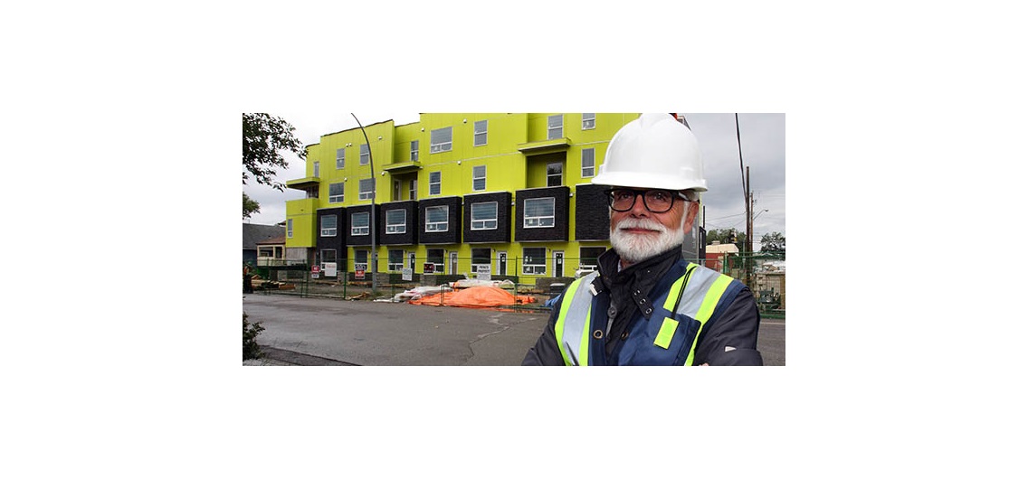 Attainable Homes CEO David Watson stands outside of the not-for-profit organization's Mount Pleasant 1740 project. Watson said local agencies like his are being forced to be more creative in addressing the city's affordable housing needs. Photo by Wil Andruschak, for CREB®Now.