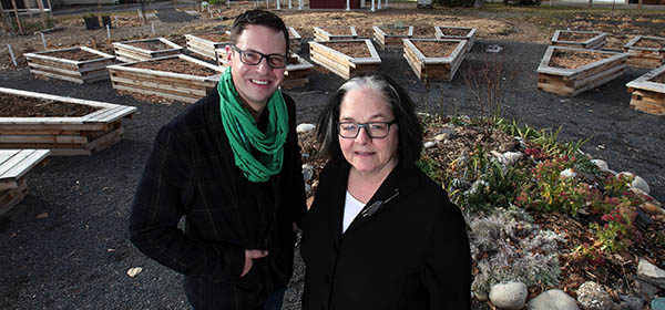 Bev Sandalack, associate dean (academic) with the University of Calgary's Faculty of Design, with Parkdale Community Association president Colin Brandt at the Parkdale Garden. Photo by Wil Andruschak/For CREB®Now