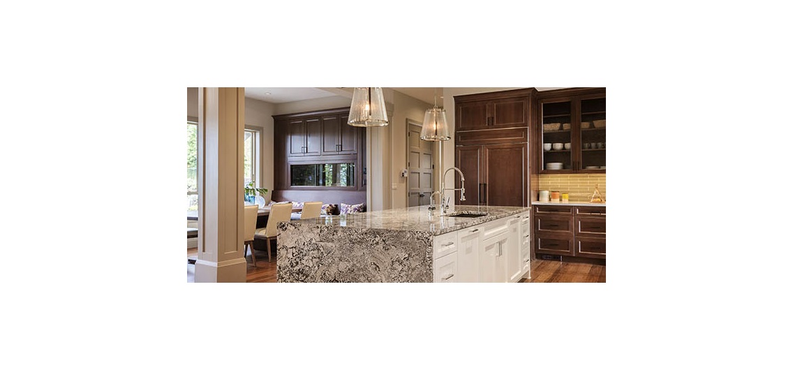 Kitchen with wood beams, white cabinets, hardwood floors