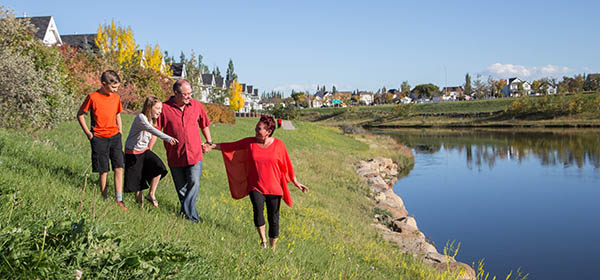 Clifford Koss and Janice Conley with their children Steven and Sophia in McKenzie Towne. Photo by Adrian Shellard/For CREB®Now