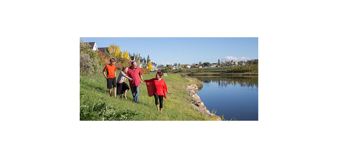 Clifford Koss and Janice Conley with their children Steven and Sophia in McKenzie Towne. Photo by Adrian Shellard/For CREB®Now