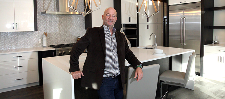 Cook Custom Homes presdient Brian Cook, pictured in his company's show home at the Point in Patterson Heights, said those who are working in economy-friendly industries are still building homes. Photo by Wil Andruschak/for CREB®Now.