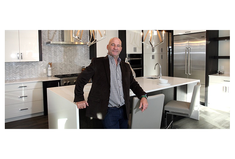 Cook Custom Homes presdient Brian Cook, pictured in his company's show home at the Point in Patterson Heights, said those who are working in economy-friendly industries are still building homes. Photo by Wil Andruschak/for CREB®Now.
