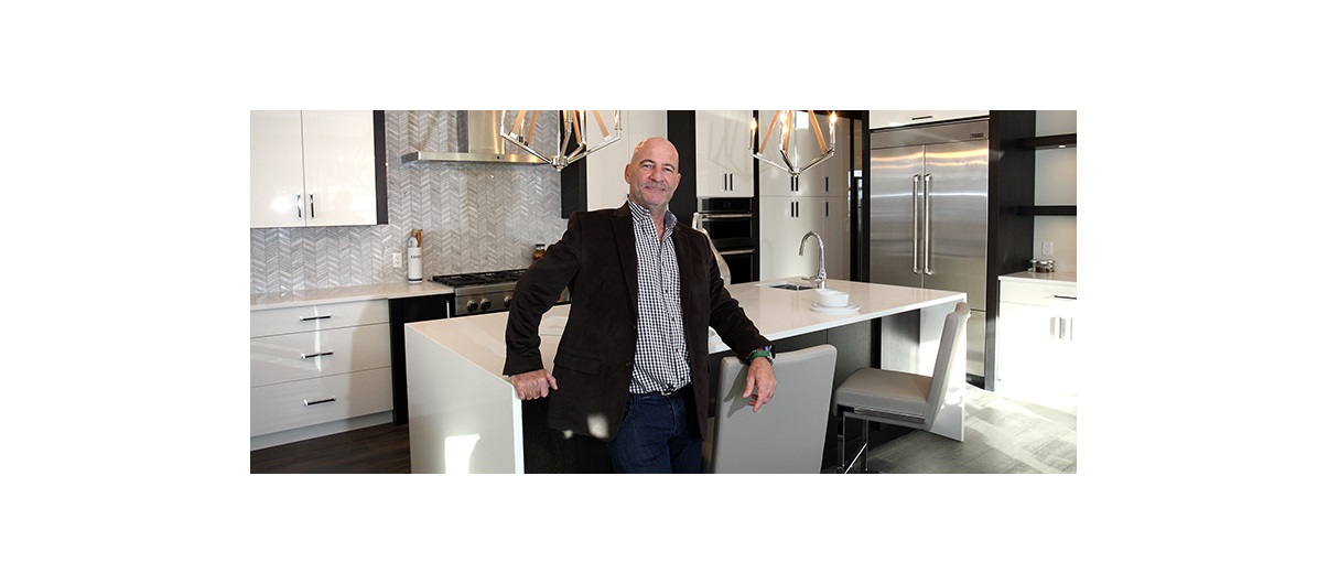 Cook Custom Homes presdient Brian Cook, pictured in his company's show home at the Point in Patterson Heights, said those who are working in economy-friendly industries are still building homes. Photo by Wil Andruschak/for CREB®Now.