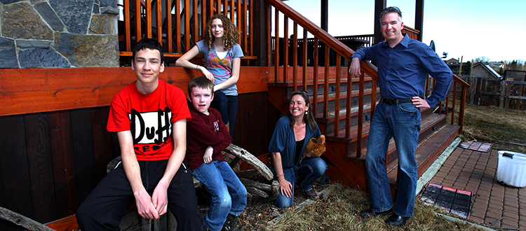 The Nelligan family (from left: Jasper, Angus, Paris, Frankie-Lou and Bruce) off the back deck on their Westmeadows Estates Acreage west of Calgary. Photo by Wil Andruschak/For CREB®Now