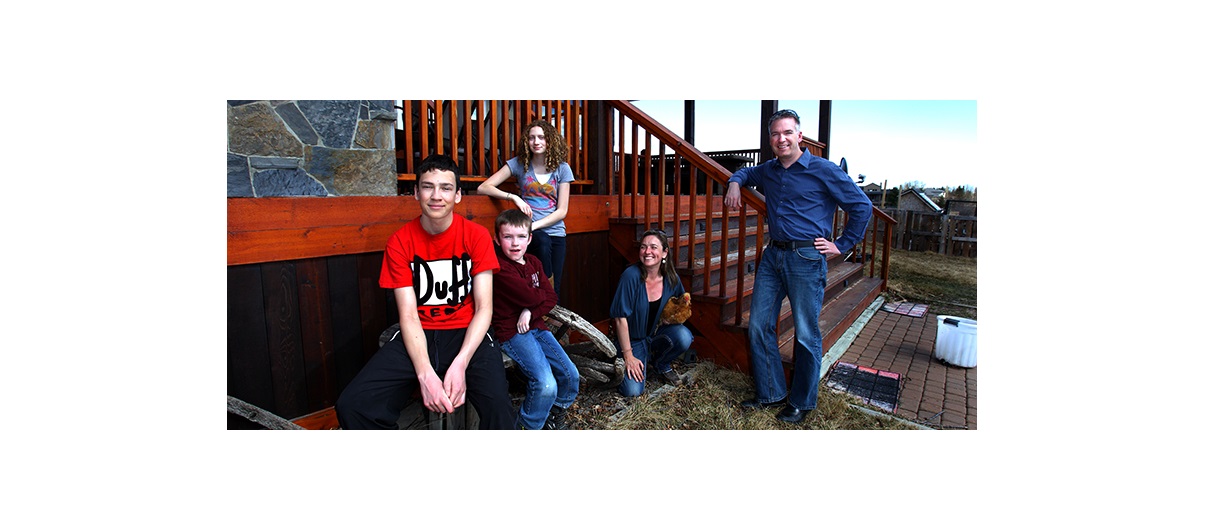 The Nelligan family (from left: Jasper, Angus, Paris, Frankie-Lou and Bruce) off the back deck on their Westmeadows Estates Acreage west of Calgary. Photo by Wil Andruschak/For CREB®Now