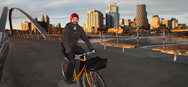 Bike Calgary president Agustin Louro, pictured on the St Patricks Island connector bridge in East Village, believes cycling infrastructure needs to be improved before a bike-share system is viable in Calgary. Photo by Wil Andruschak/For CREB®Now