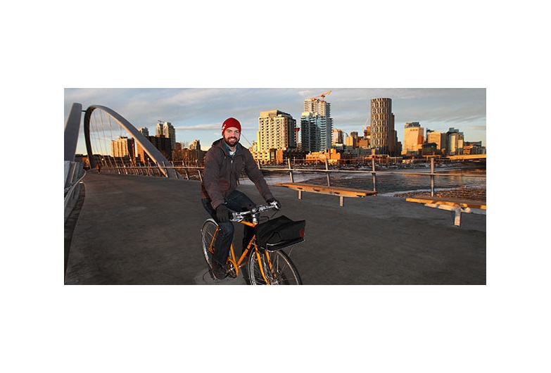 Bike Calgary president Agustin Louro, pictured on the St Patricks Island connector bridge in East Village, believes cycling infrastructure needs to be improved before a bike-share system is viable in Calgary. Photo by Wil Andruschak/For CREB®Now