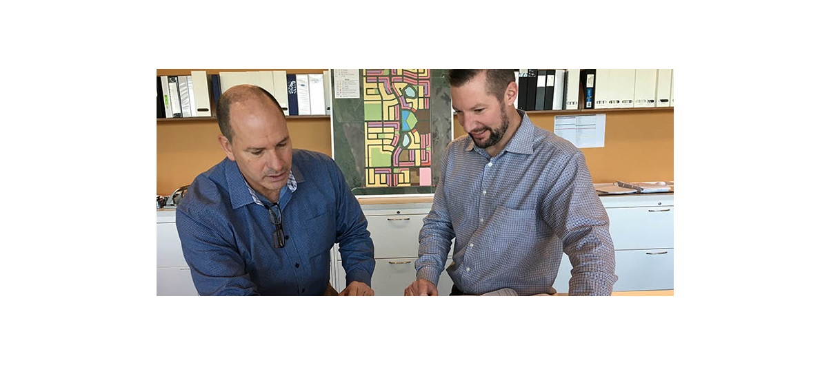 Mattamy Homes Calgary division president Don Barrineau, left and vice-president of land development Collin Campbell say plans for Yorkville call for a blend of walkability, residential and retail. Photo courtesy Mattamy Homes.