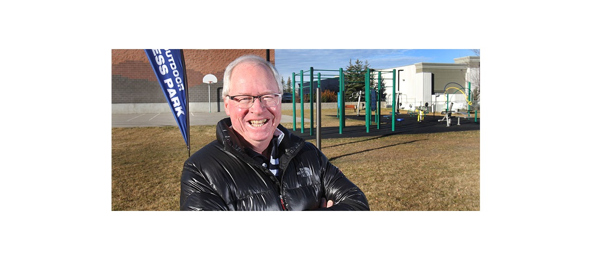 Dave McCarrel stands next to a new outdoor fitness park in Valley Ridge that opened earlier this fall. McCarrle has kept active within the local community association over the past 20 years because he feels it has helped make Valley Ridge a better place to live. Photo by Wil Andruschak/For CREB®Now