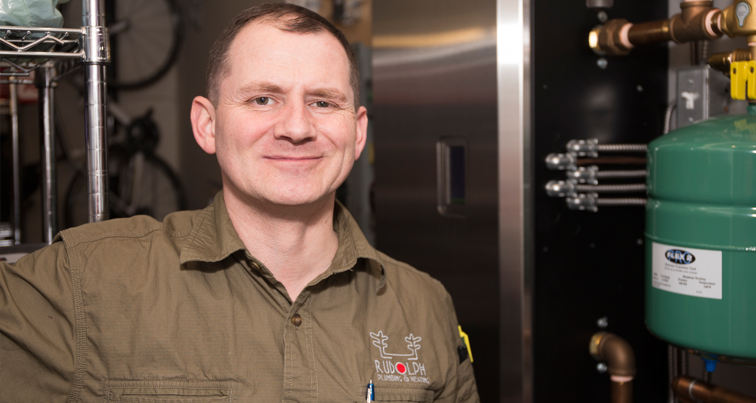 Stuart Rudolph, president of Rudolph Plumbing & Heating Inc. says tankless water heaters and power direct-vented tank-type models are increasingly being installed in Calgary homes. Photo by Tyler Klinkhammer / For CREB®Now