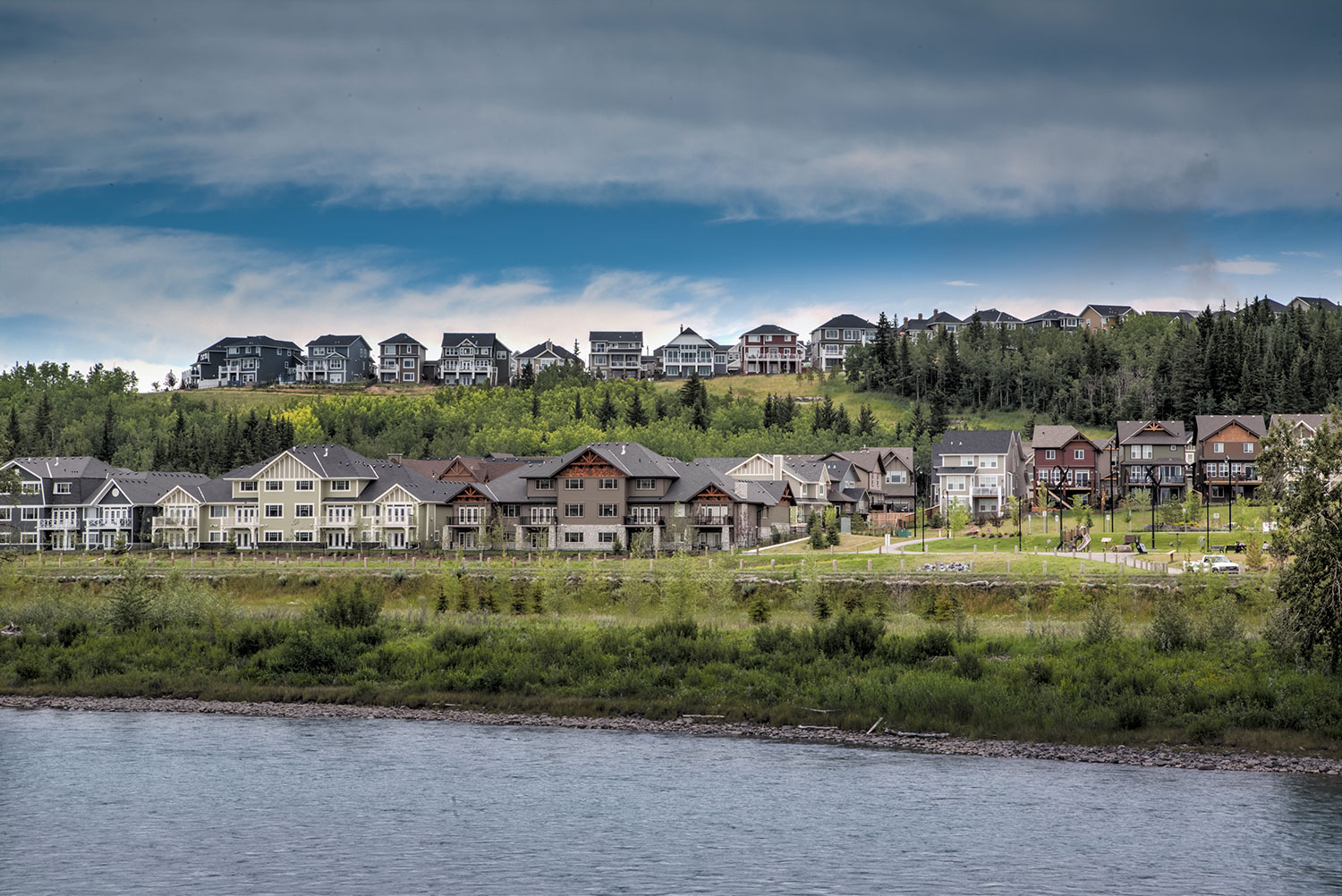 With three distinct neighbourhoods, Riversong covers 320 acres with a portion running along the south shore of the Bow River.   Photo courtesy Tamani Communities.