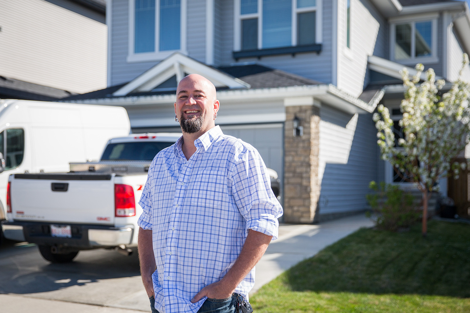 Nathan Magee stands proudly in front of his newly purchased home after renting for 14 years. Photo by Adrian Shellard / For CREB®Now