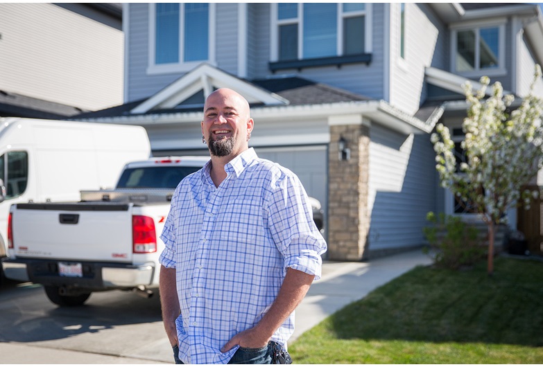Nathan Magee stands proudly in front of his newly purchased home after renting for 14 years. Photo by Adrian Shellard / For CREB®Now