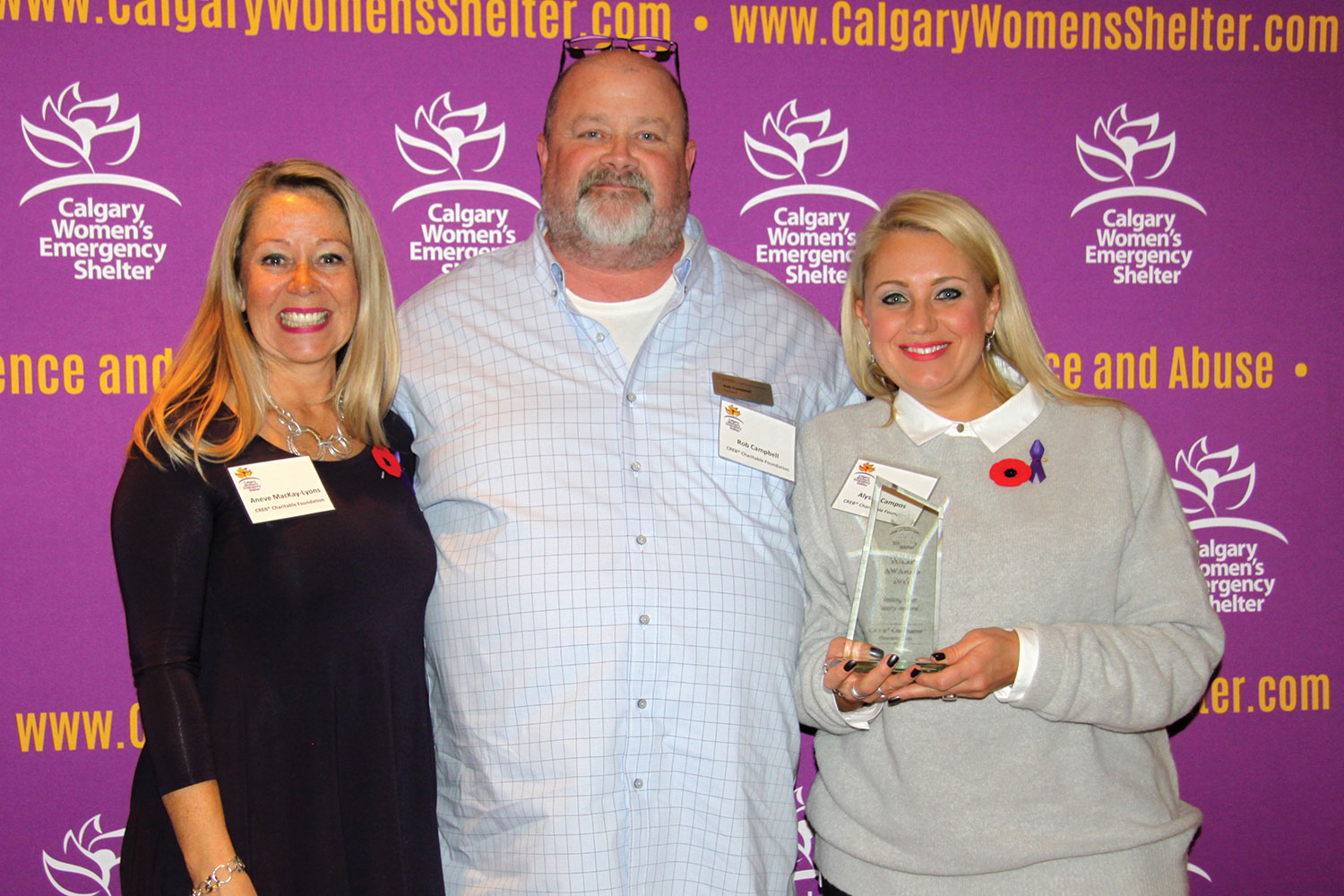 CREB® Charitable Foundation manager  Aneve MacKay-Lyons, president Rob Campbell and president-elect Alyssa Campos at the Calgary Women’s Emergency Shelter’s Tulip Awards on Nov. 8 at Fort Calgary.
Courtesy Calgary Women's Emergency Shelter