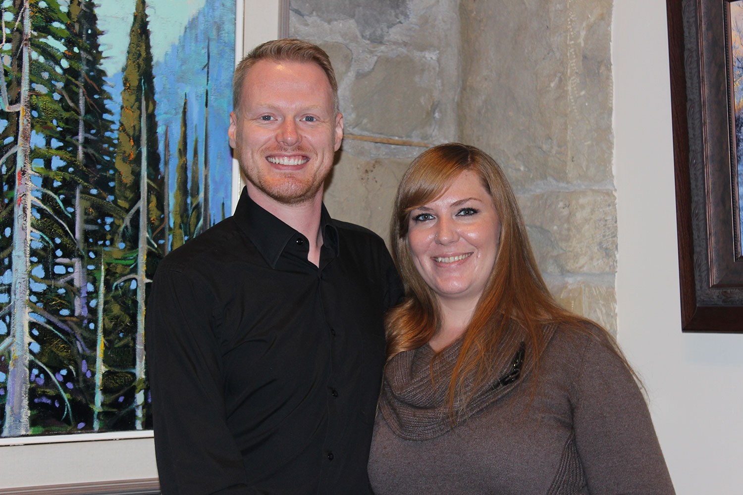 Trevor Gibbs and Melissa Wellingtan chose a townhome with many of the benefits of a detached, single-family home, including a double attached garage, fenced front yard and backyard, and undeveloped basement. 
Andrea Cox / For CREB®Now